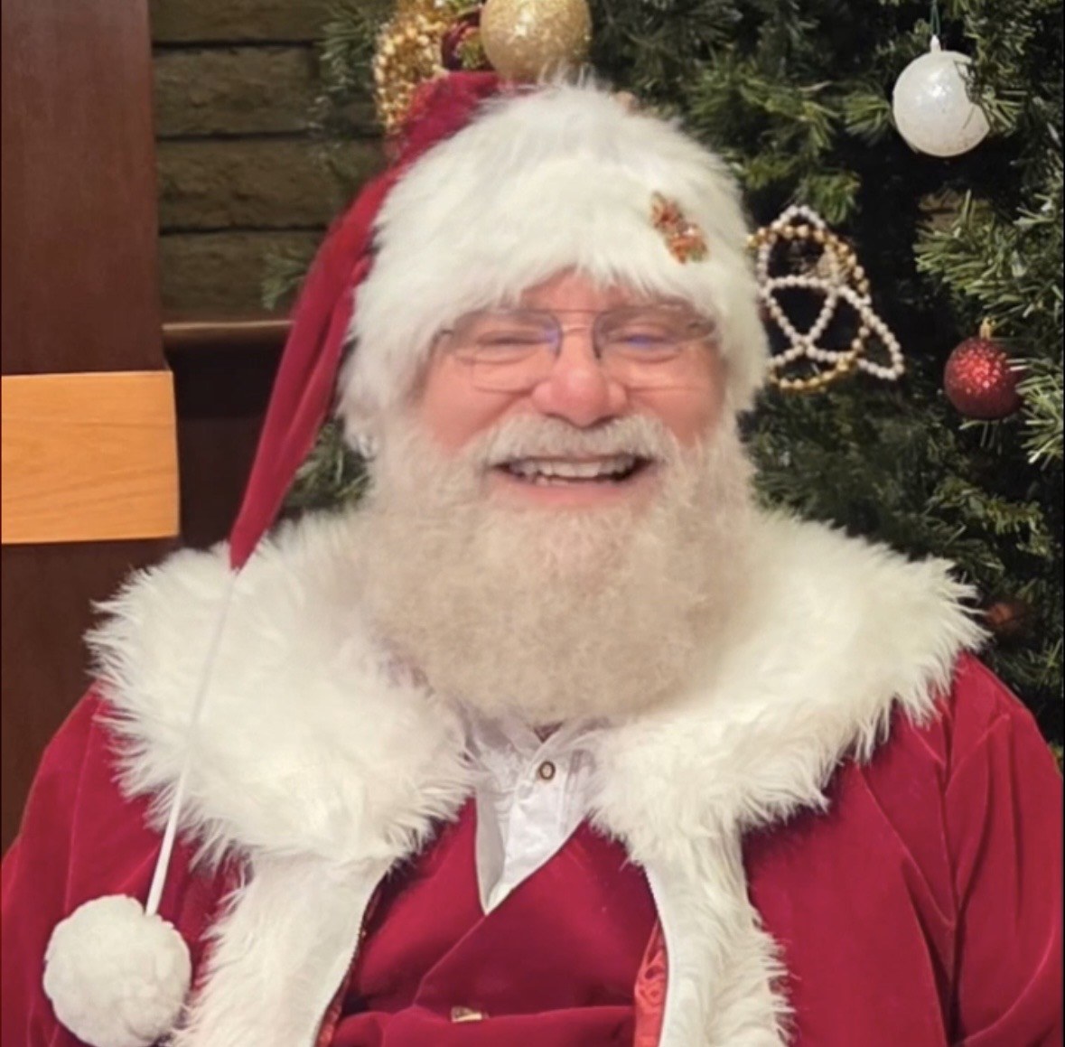 Santa laughing in his red velvet suit